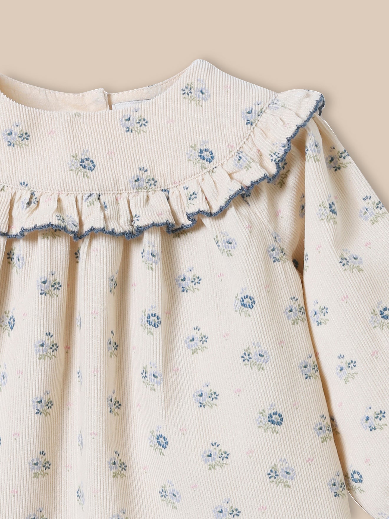 Baby-Guimpe aus Cordsamt mit « CLAUDY »-Print