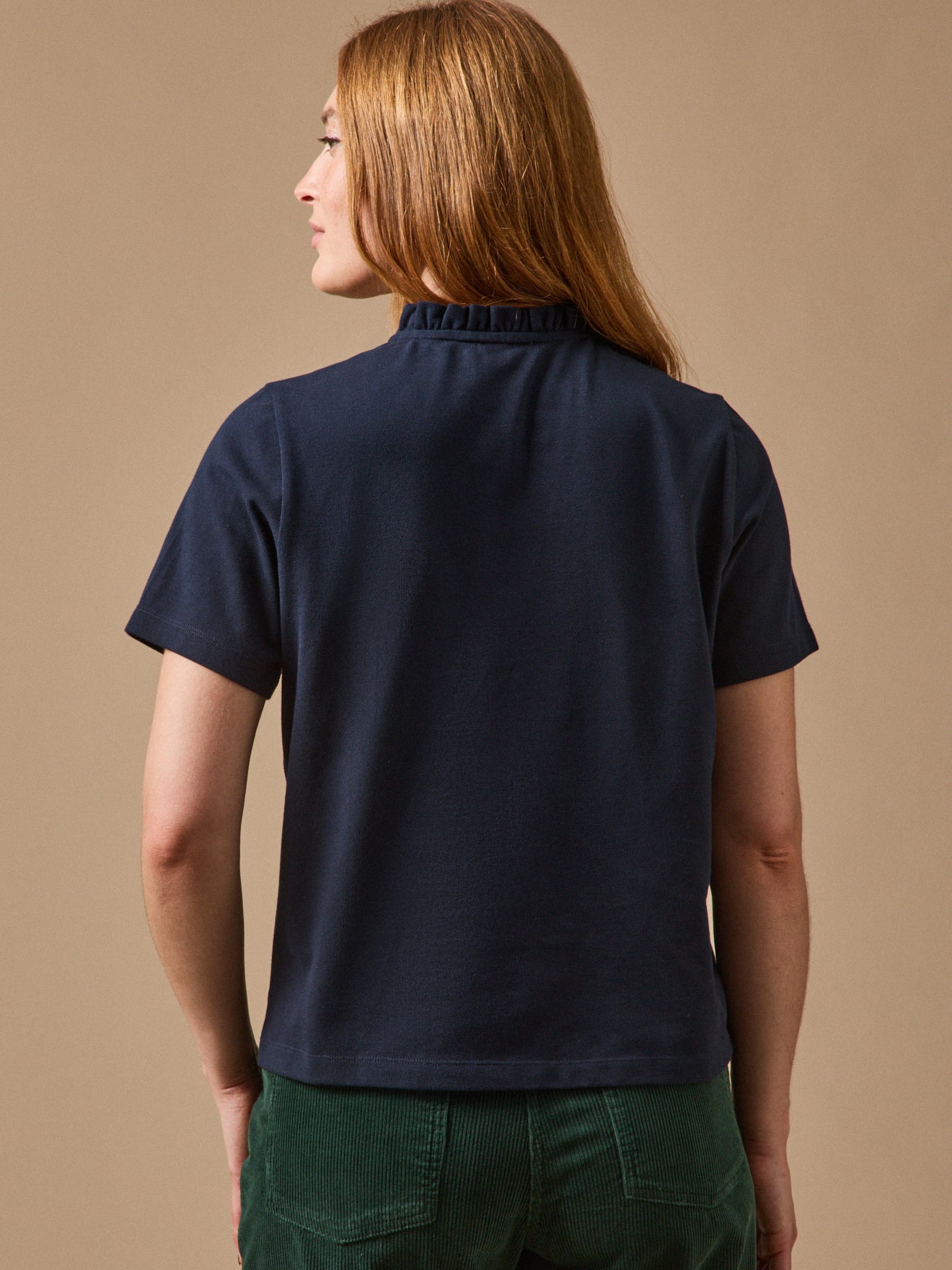 Damen-Poloshirt mit Volants am Kragen