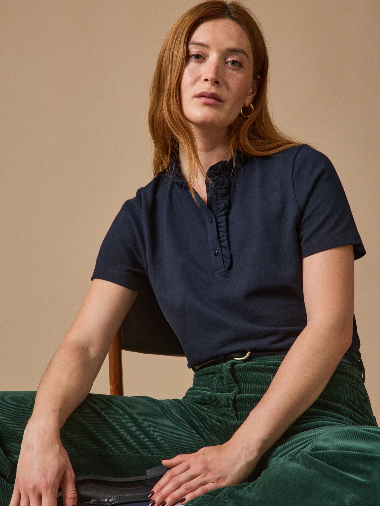 Damen-Poloshirt mit Volants am Kragen