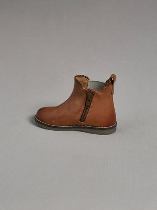 Baby-Schuhe aus Leder mit Festonborte